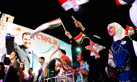 Supporters of Syrian President Bashar al-Assad celebrate his birthday in Damascus