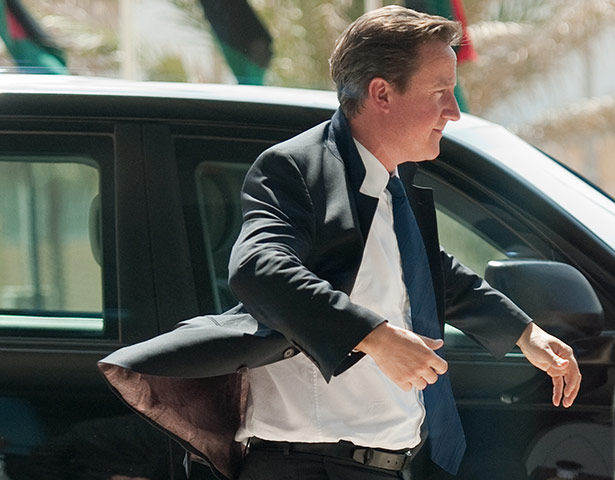 Cameron in Tripoli: Prime Minister David Cameron arrives at the Corinthia hotel 