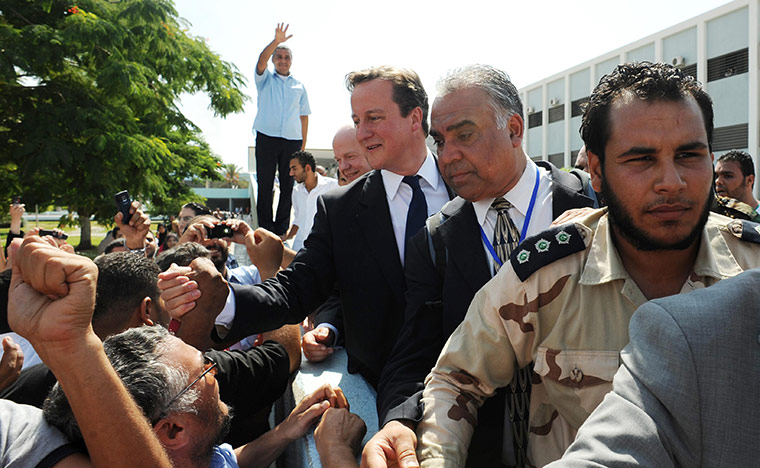 Cameron in Tripoli: Prime Minister David Cameron is greeted by at the Tripoli Medical Centre