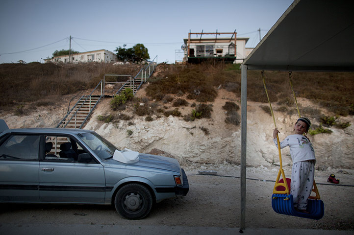 24 hours in pictures: Hvat Gilad, West Bank: A boy plays outside his home