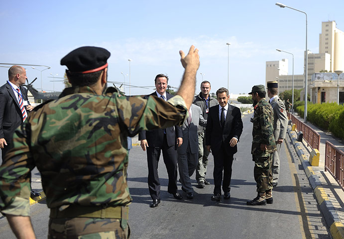 Cameron in Tripoli: Sarkozy and Cameron are greeted by pro-NTC combatants 