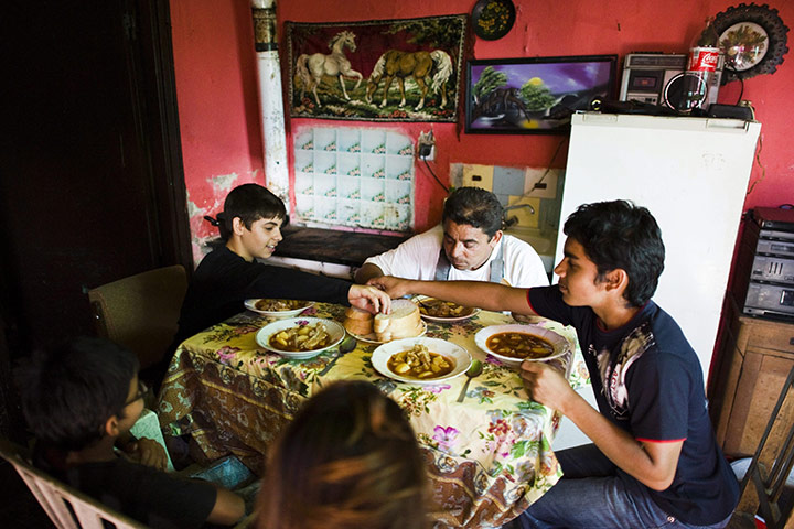 FTA: Attila Balazs: Shift-manager Jozsef Vadasz, centre, has dinner with his family