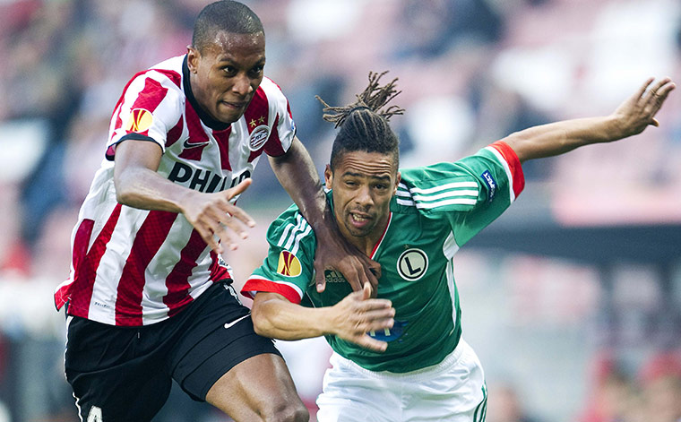 Europa League: Legia Warsaw's Manu, right, tussles with PSV Eindhoven's Marcelo