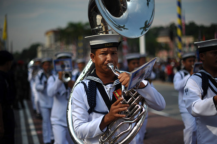 24 hours in pictures: Navy military band march during the Malaysia Day and Independence Day