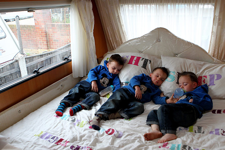 Dale Farm: Triplets John 'Button', David and Richard Sheridan asleep in their trailer