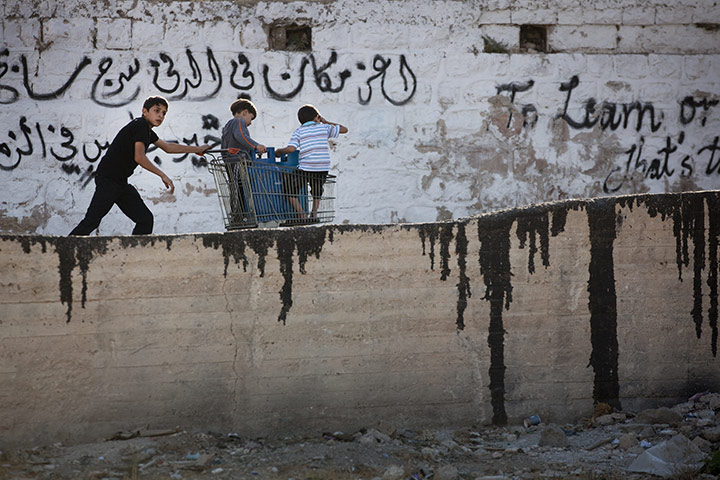Levene West Bank: Boys hanging out in Hebron Old City