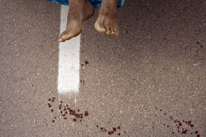 24 hours: Abu Adi, Libya: The feet of a rebel on a pick up truck who was killed
