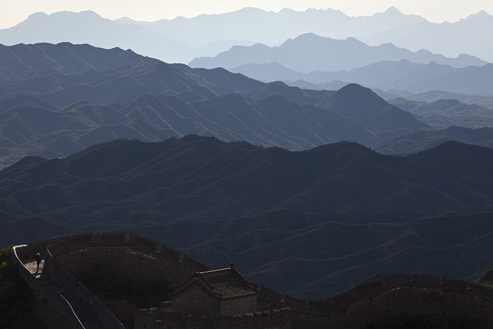 24 hours: Luanping, China: A tourist walks on the Great Wall of China,  at sunset