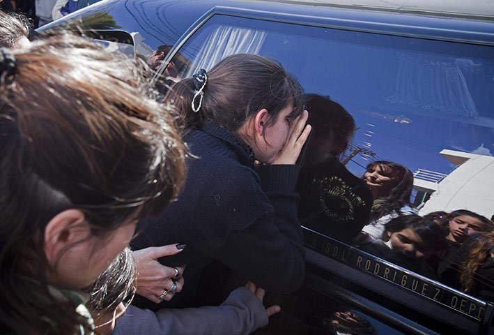 24 hours in pictures: hearse carrying the body of 11-year-old  murder victim Candela Rodriguez 