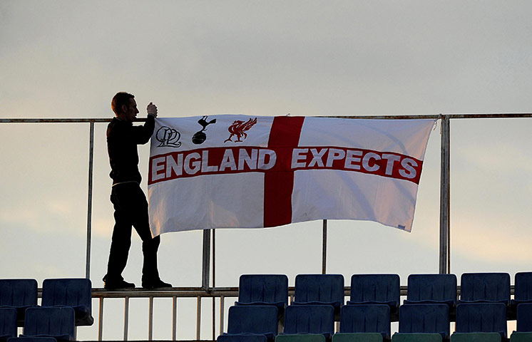 Bulgaria v England: An England fan puts a flag up before the game against Bulgaria