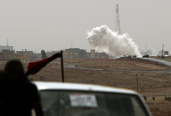 Libya fighting continues: An NTC convoy comes under artillery attack in Bani Walid as fighting raged 