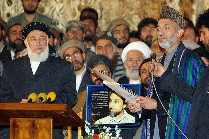 President Rabbani: 2001: Afghanistan's leader Hamid Karzai (R) holding a doctorate degree