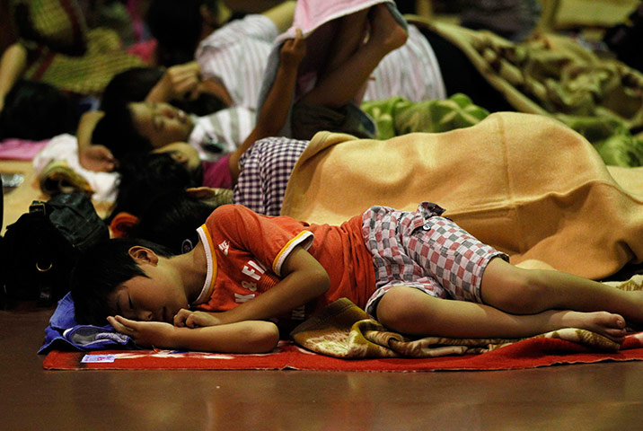 Typhoon Roke: Evacuees rest at an evacuation centre in Nagoya