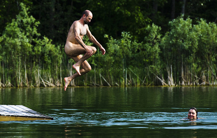 FTA: Mark Blinch: Park manager Karen Grant swims as her husband Bruce jumps into the water 