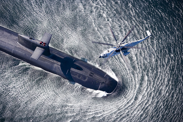 The Sea: A helicopter hovering above a submarine off the coast of Brittany