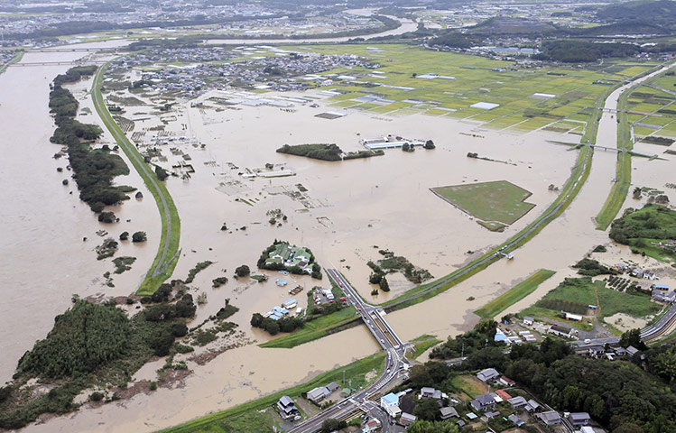 Typhoon Roke: Farmlands are under waters flooded from the Toyo River in central Japan