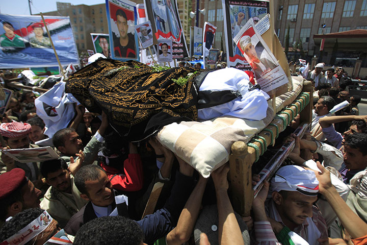 Yemen violence resumes: The body of a protester is carried during a mass funeral in Sanaa