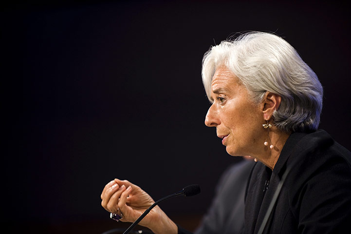 Week in Business: IMF Managing Director Christine Lagarde responds during a press conference