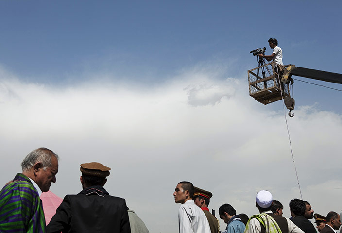 Rabbani funeral: A TV cameraman films the burial ceremony