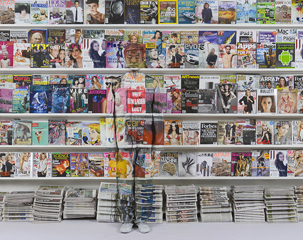 Magazine rack by Liu Bolin