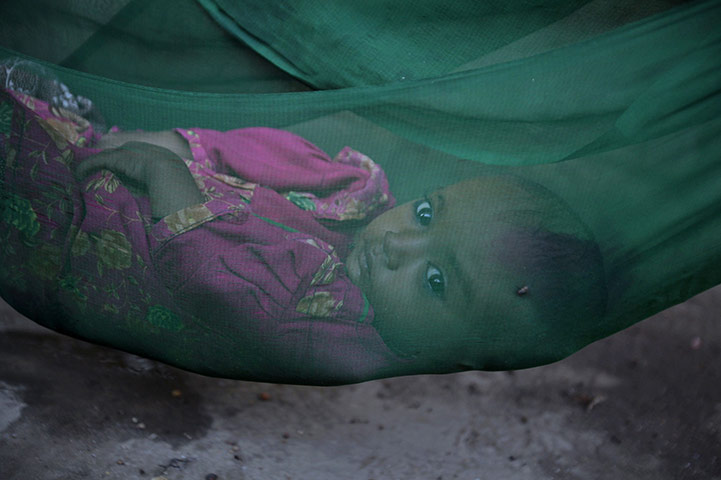 24 hours in pictures: Badin district, Pakistan: Nazia lies in a hammock