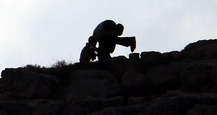 West Bank clashes: Palestinians evacuate a man who wasshot dead by Israeli troops near Qusra