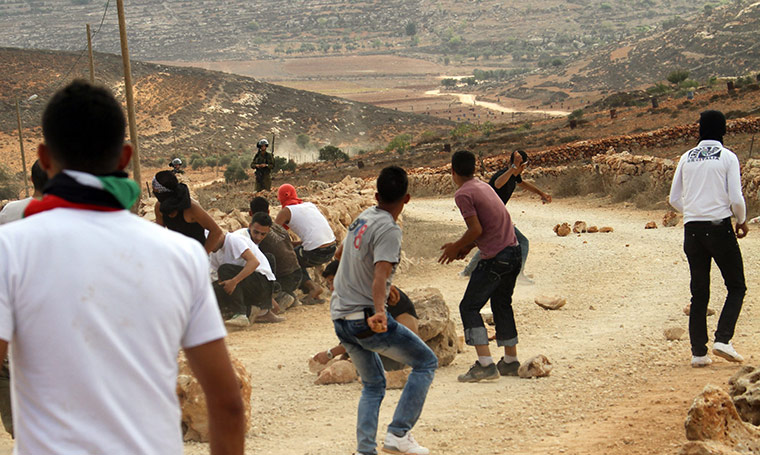 West Bank clashes: Palestinians hurl stones at Israeli troops during clashes at Qusra 
