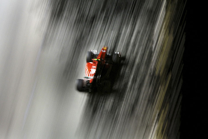 24 Hours: Ferrari driver Felipe Massa of Brazil steers his car in Singapore