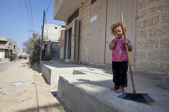 Palestinian Lives: A girl with Broomstick at the Brazil refugee camp, Rafah