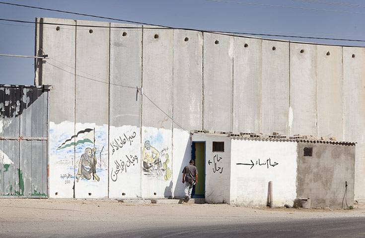 Palestinian Lives: A toilet by the wall barrier near to the crossing point into Egypt, Rafah