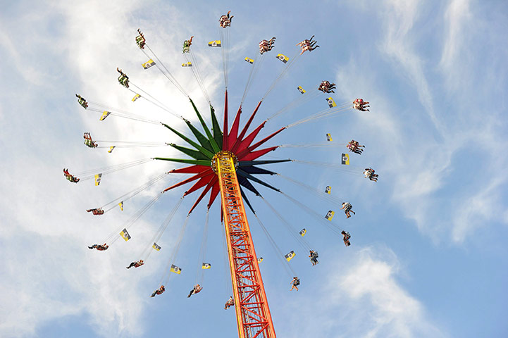 24 hours in pictures: Munich, Germany: Visitors at the 178th Oktoberfest fly high on a carousel