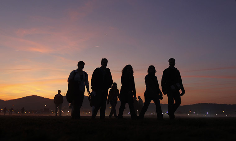 24 hours in pictures: Freiburg, Germany: Pilgrims walk to a mass with Pope Benedict XVI