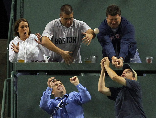 Pix of the week: Boston Red Sox fans try to catch Baltimore Orioles Mark Reynolds' home run