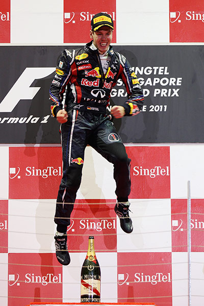 Singapore Grand Prix: Sebastian Vettel jumps for joy on the podium in Singapore