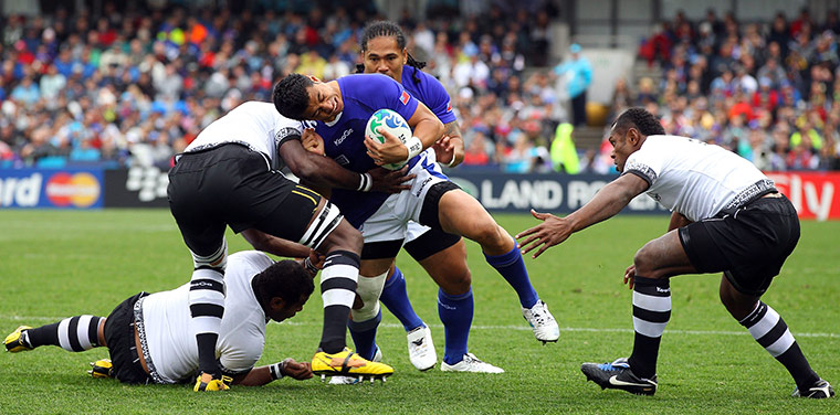 Fiji v Samoa: George Pisi is stopped by the Fijian defense