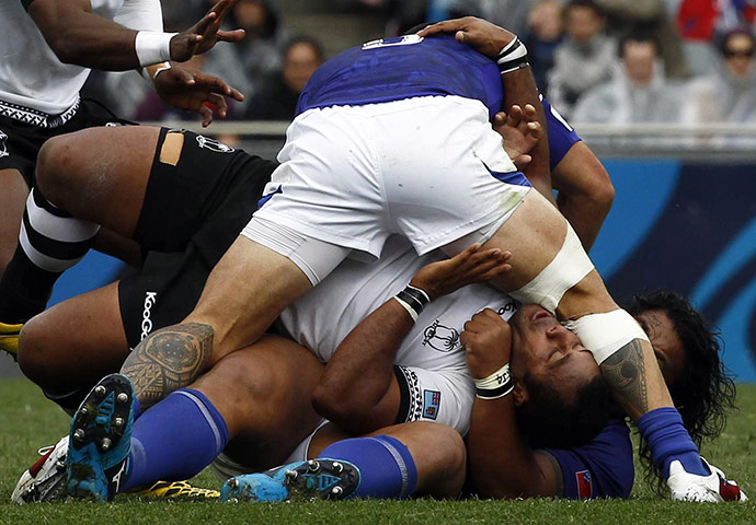 Fiji v Samoa: Fiji's Sunia Koto is held in a tackle against Samoa