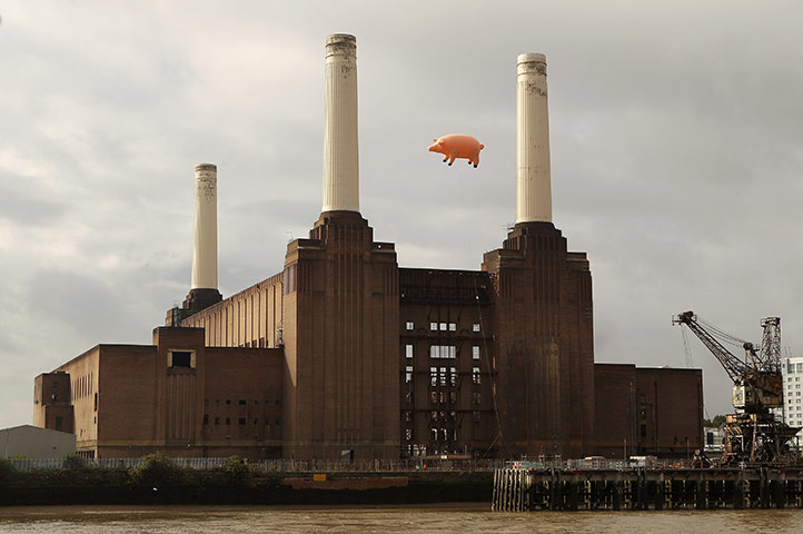 24 hours: London, England: An inflatable pig flies above Battersea Power Station