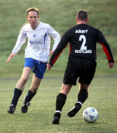 MP's playing football: Scottish Secretary Jim Murphy during a charity football match