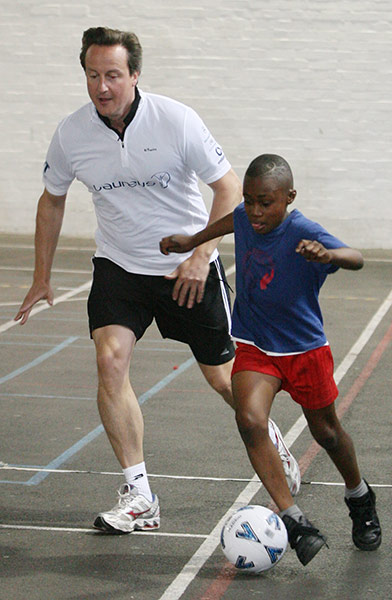 MP's playing football: David Cameron joins in with a game of football at Lilian Baylis Old School
