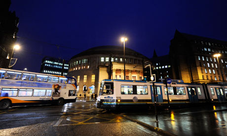 Traffic and trams in Manchester city centre.