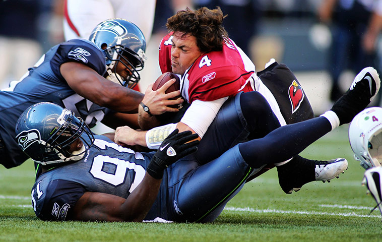 NFL roundup: Kolb loses his helmet during the fourth quarter of their game in Seattle