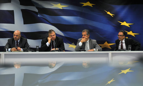 Greek finance minister Evangelos Venizelos and aides