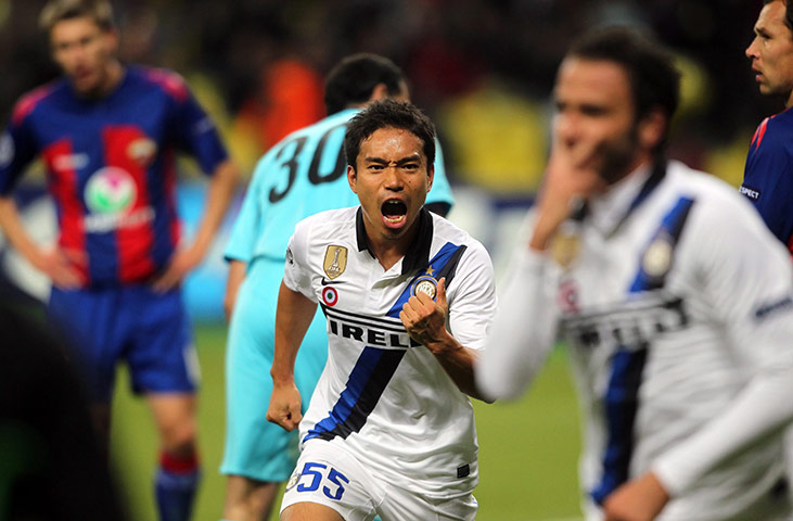 Champions League Tuesday: nter Milan's Yuto Nagatomo rushes towards team-mate Giampaolo Pazzini