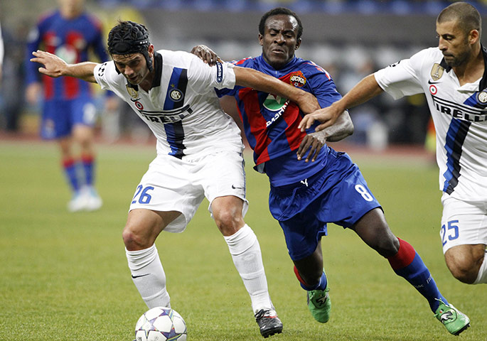 Champions League Tuesday: Inter Milan's Cristian Chivu shields the ball from CSKA's Seydou Doumbia