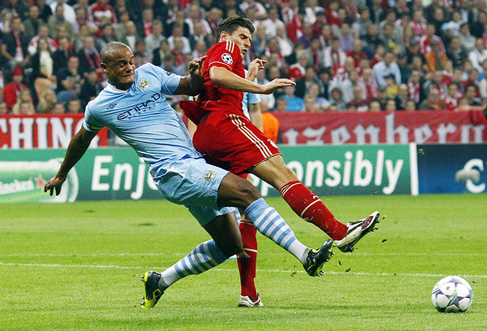 Champions League Tuesday: Manchester City's Vincent Kompany clears the ball from Bayern's Mario Gomez