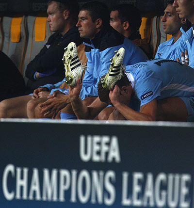 Champions League Tuesday: A frustrated Eden Dzeko bashes his boots in frustration after being subbed