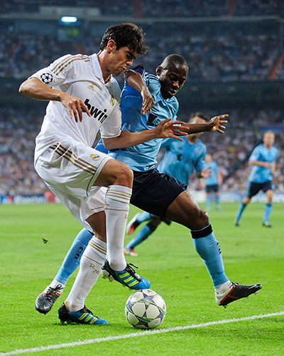 Champions League Tuesday: Kaka (L) of Real Madrid is tackled by Eyong Enoh of AFC Ajax 