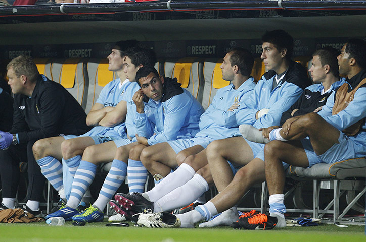Champions League Tuesday: Manchester City's Carlos Tevez sits on the substitutes bench