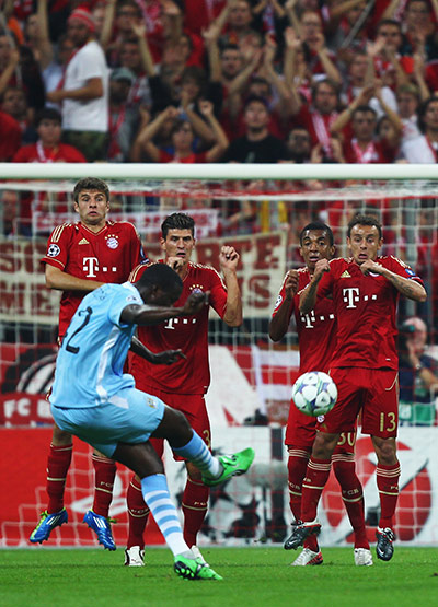 Champions League Tuesday: Yaya Toure takes a free kick against Bayern Munich
