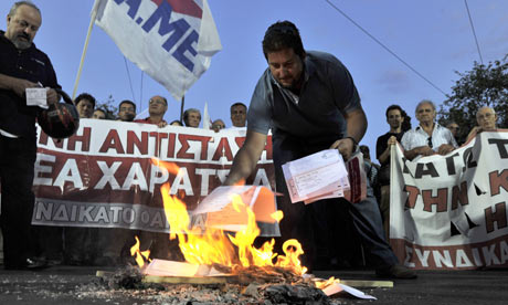 Greek protesters burning emergency tax notices